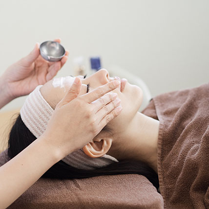 Woman receiving facial care