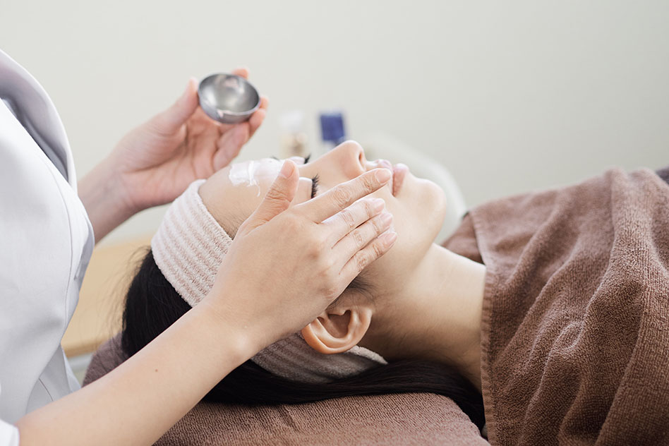 Woman receiving facial care